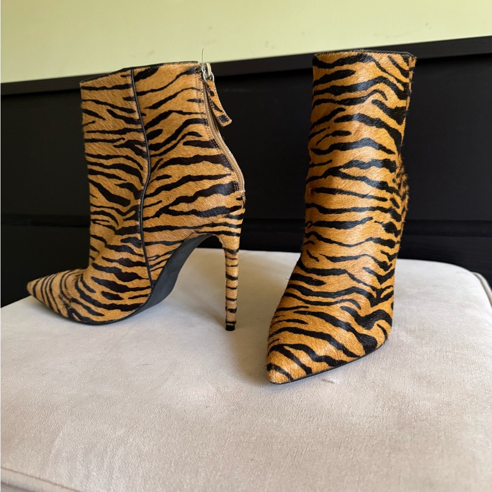 Orange and Black Heeled Boots with Sleek Design